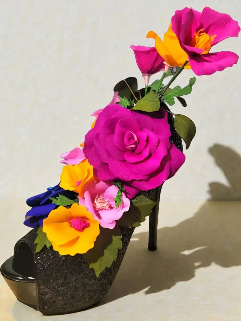 A stiletto show filled with roses and California poppies.