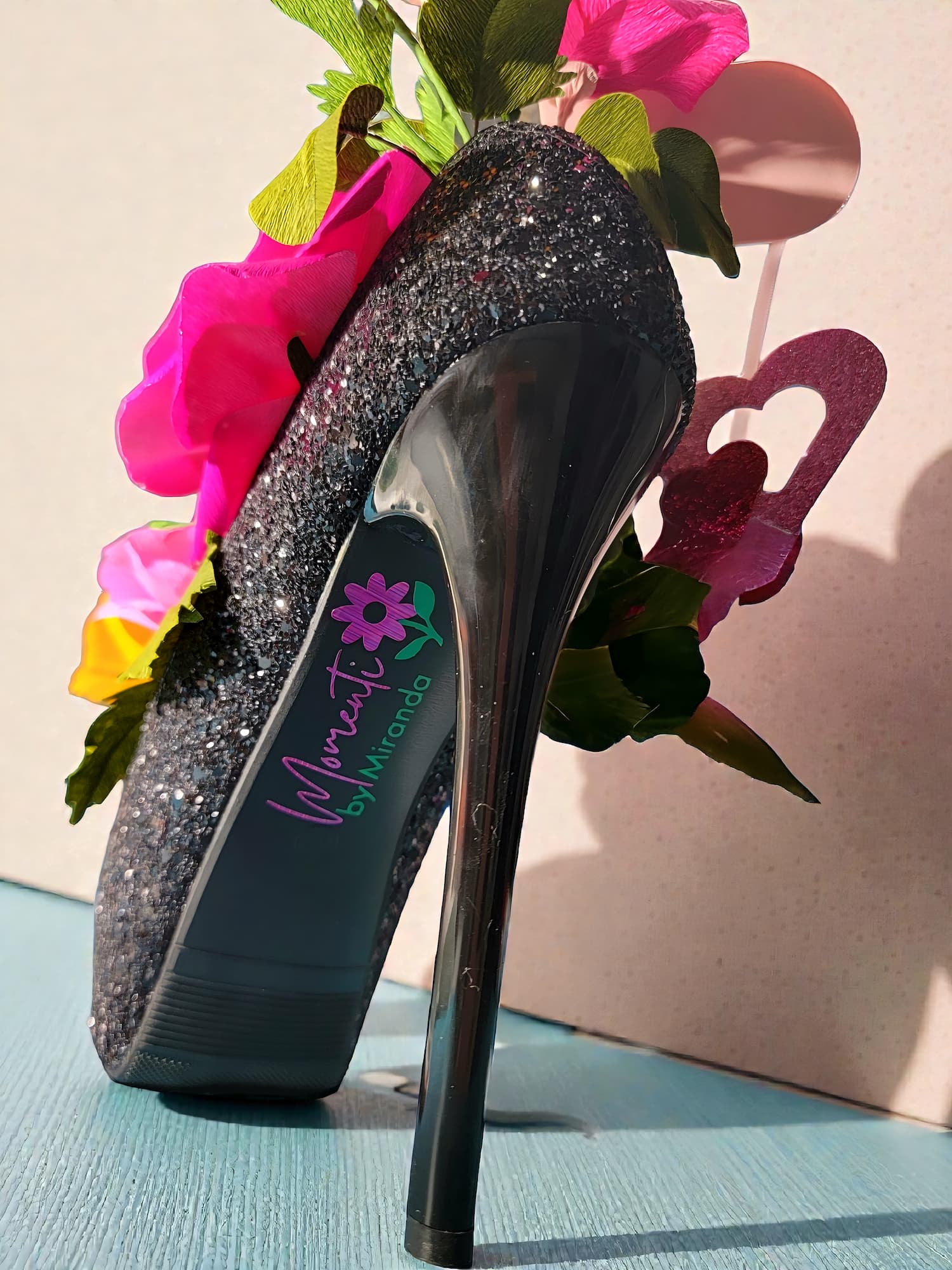 Shoe filled with paper flowers